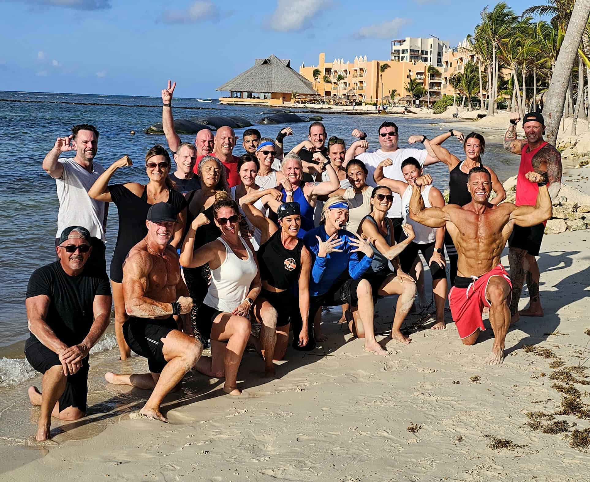 Group fitness retreat participants on the beach at SoulFit Retreat, promoting health and wellness.