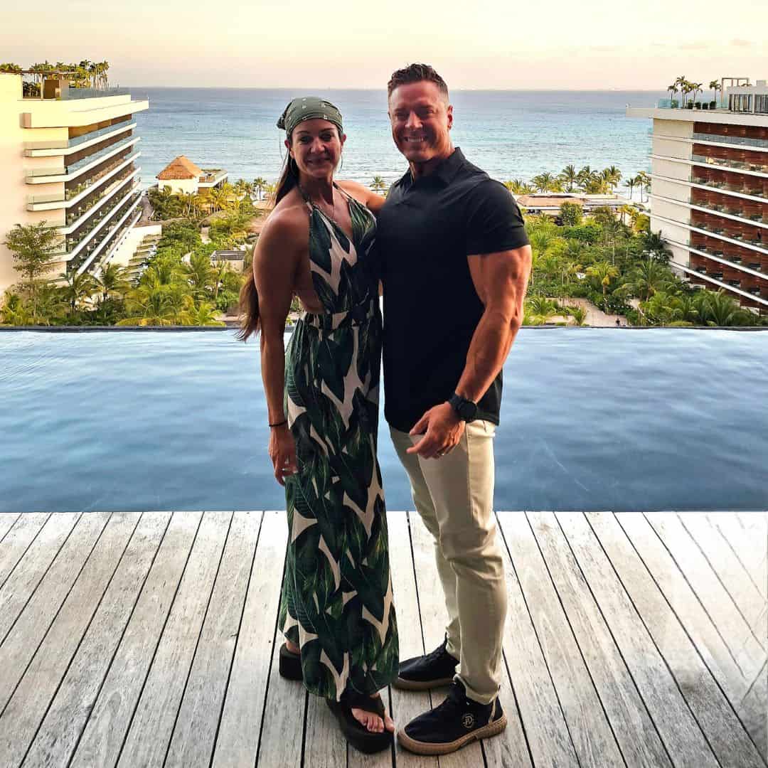 Relaxed couple at sunset overlooking the ocean from Soulfit Retreat, Mexico.